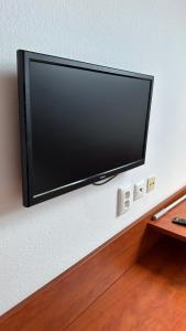 a flat screen tv hanging on a wall at Penzión Lindava in Budmerice
