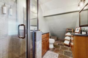 a bathroom with a shower and a toilet in it at Bass Lake Lodge in Bass Lake +32 photos