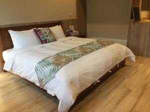 Voodi või voodid majutusasutuse Enjoy Homestay toas