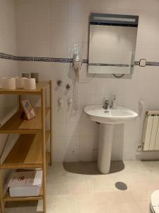 a bathroom with a sink and a shower at Escuelas de collía B AT-1537-AS in Arriondas +20 photos