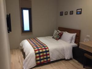 Voodi või voodid majutusasutuse Enjoy Homestay toas