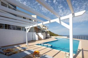 a swimming pool on the roof of a house at Tersanas Seaside Apartment in Tersanas