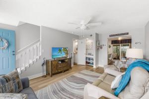 a living room with a couch and a tv at San Marco Villas H-3 in Marco Island