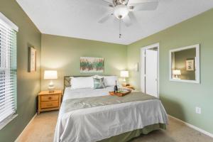 a bedroom with a bed and a ceiling fan at San Marco Villas H-3 in Marco Island +47 photos