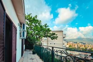 a balcony with a view of a city at Paradise Garden Villa in Bečići
