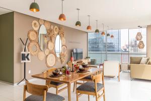 a dining room with a table and chairs at Casa Reforma by Kukun in Mexico City