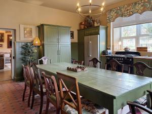 a kitchen with a large wooden table and chairs at Property 472 - Kylemore in Kylemore