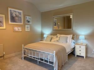 a bedroom with a bed and a mirror on the wall at Property 472 - Kylemore in Kylemore