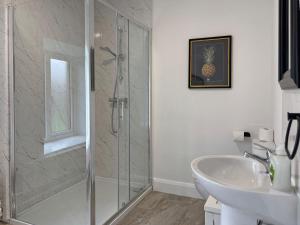 a bathroom with a shower and a sink at Property 472 - Kylemore in Kylemore +42 photos