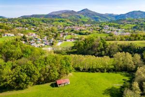 an aerial view of a small village in the hills at Le Xilotik Gîte in Espelette
