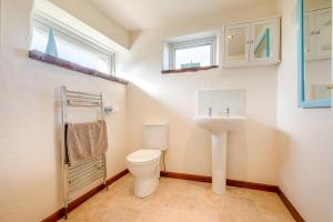 a bathroom with a toilet and a sink at 1 Bed in Padstow oc-p00554 in Saint Merryn +22 photos