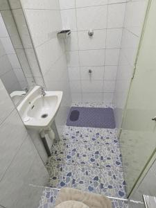 a bathroom with a sink and a shower at Favoured Brink in Nairobi
