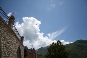 a view of the sky from a building with mountains in the background at Agriturismo La Grotta in Corbara