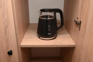 a black appliance sitting inside of a door at Elysium1 in Banja Luka