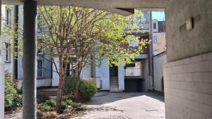 an empty alley in a city with a building at Umińskiego Spacious Apartment in Poznań