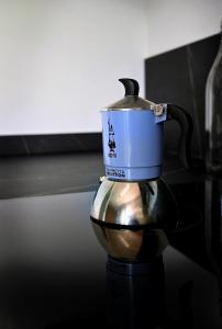 a tea pot on top of a kettle on a table at Lake Retreat in Anfo