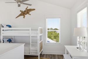 a white room with a bunk bed and a window at Perfect location Pool 4 bedroom SGI Pet in Eastpoint