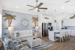 a living room with a couch and a kitchen at Perfect location Pool 4 bedroom SGI Pet in Eastpoint +40 photos