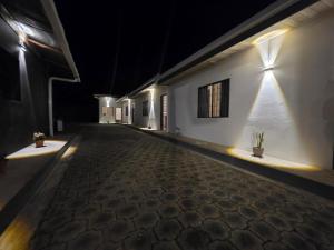 an empty hallway of a building at night at Volcano Hostal in Rivas +5 photos