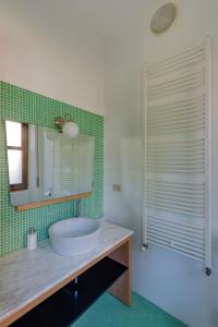 a bathroom with a sink and a mirror at Scenarium in Udine