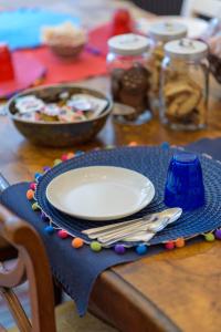 a table with a plate of food on a table at Scenarium in Udine +4 photos