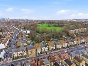 an aerial view of a city with houses and a golf course at Modern 2 bedroom flat, SE6 in Catford