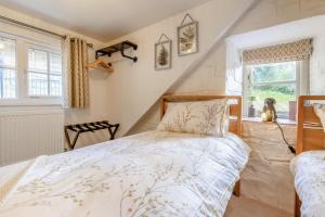 a bedroom with a bed and a window at 2 Bed in Cwmystwyth oc-p32779 in Pentre-briwnant