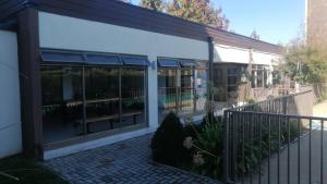 a screened in porch of a house with windows at privilegio apart in Los Ángeles