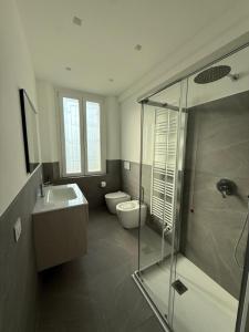 a bathroom with a shower and a sink and a toilet at Tesorella guest house in Cassano dʼAdda +10 photos