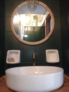 a bathroom with a sink and a mirror at Deli casa vacanze in Favignana