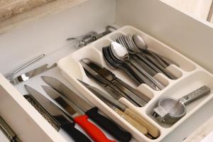 a drawer filled with knives and utensils at Casa La Vikina in Guanajuato