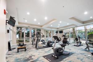 a gym with treadmills and elliptical machines at Legacy Tower II 107 Deluxe in Gulfport