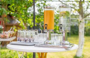 a white table with glasses on top of it at Villa Anna in Darłowo +20 photos