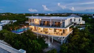 an aerial view of a house with a swimming pool at Skyline Villas - Villa Skyline with stunning Ocean View in Providenciales