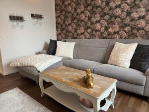 a living room with a couch and a coffee table at Herzstück in Schwanebeck