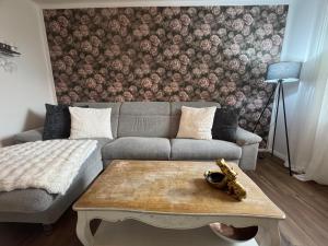 a living room with a couch and a coffee table at Herzstück in Schwanebeck