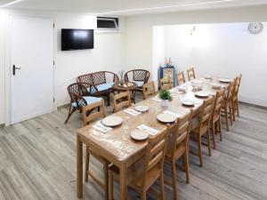 a large room with a long table and chairs at Thalassa Holiday Home with Terrace near the Sea - Anzio in Anzio