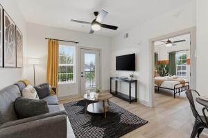 a living room with a couch and a table at The Lofts On Maney – Boutique Loft in Downtown Murfreesboro in Murfreesboro