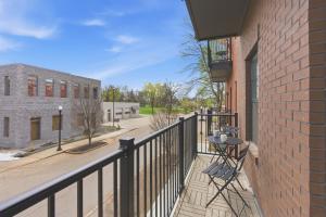 a balcony with a black railing and a building at The Lofts On Maney – Boutique Loft in Downtown Murfreesboro in Murfreesboro