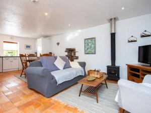 a living room with a couch and a stove at 1 Bed in New Moat oc-77692 in New Moat