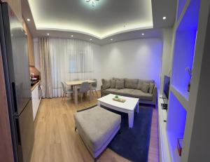 a living room with a couch and a table at Villa Hajdi Q & U in Merano