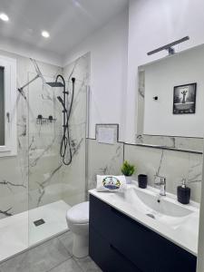a bathroom with a sink and a shower and a toilet at U Zu Ciccio in Terrasini +22 photos