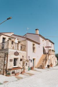 a large stone building with stairs in front of it at Borgo del Marchese in Ortona