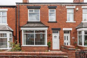 a brick house with a white door and windows at 3 Bedroom House By Cozy Quarters Property Management Contractors Accommodation Seaham Near Sea in Seaham