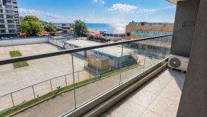a view of a city from the balcony of a building at Crystal by Solid Sea View Mamaia - Apartament langa plaja cu vedere la mare in Mamaia