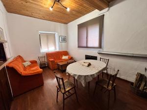 a living room with a table and a couch at Casa Villafeile in Villafeile +23 photos