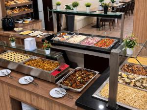 a buffet line with many different types of food at Hotel Magnific in Kranevo