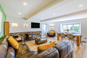 a living room with a couch and a fireplace at 2 Bed in Keswick oc-28377 in Braithwaite