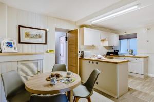 a kitchen and dining room with a table and chairs at 2 Bed in Keswick oc-28377 in Braithwaite
