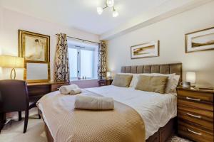 a bedroom with a bed and a desk and a chair at 2 Bed in Keswick oc-28377 in Braithwaite